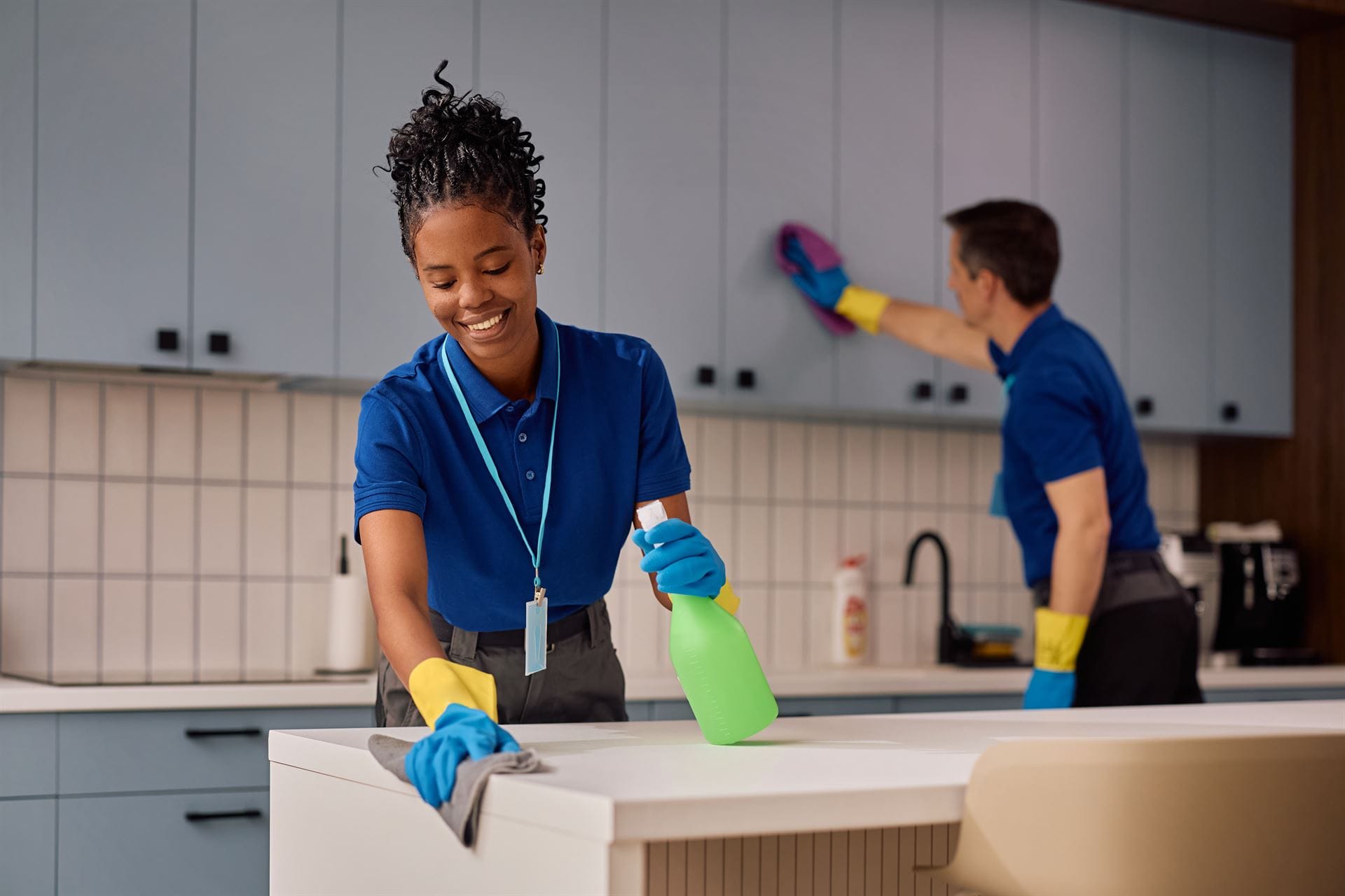 Home Clean Home cleaning team wiping down a kitchen